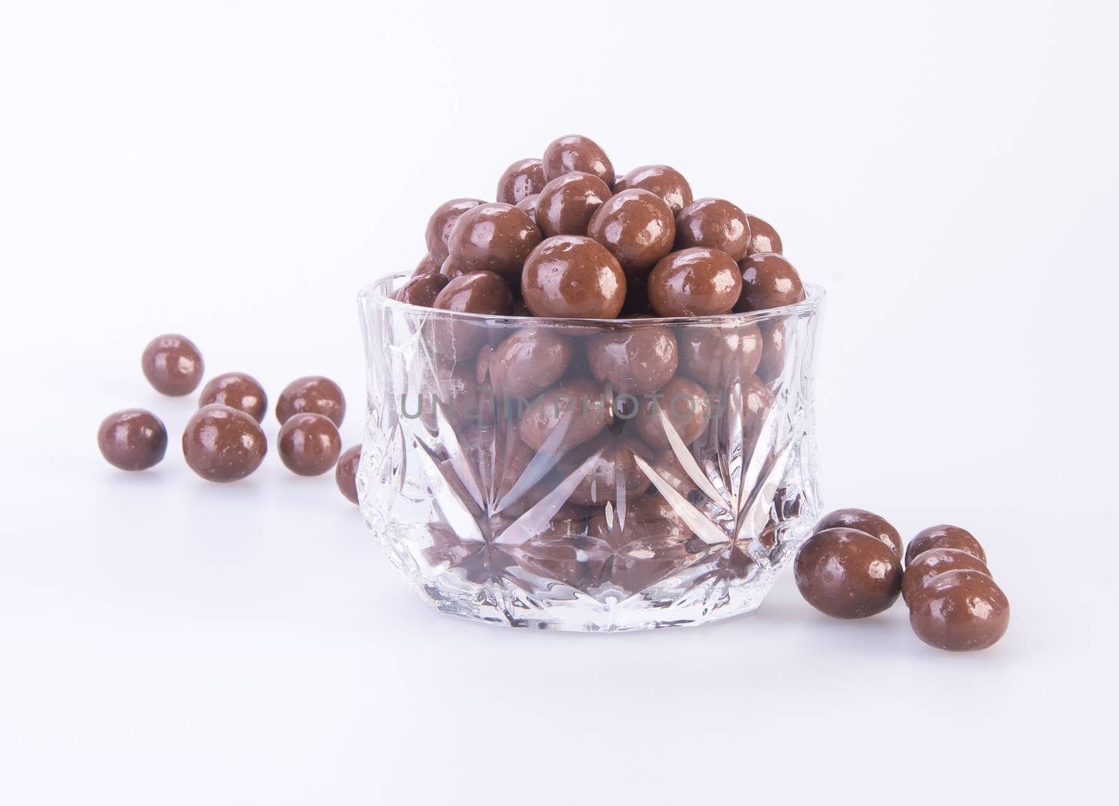 chocolate balls. chocolate balls in bowl on a background.