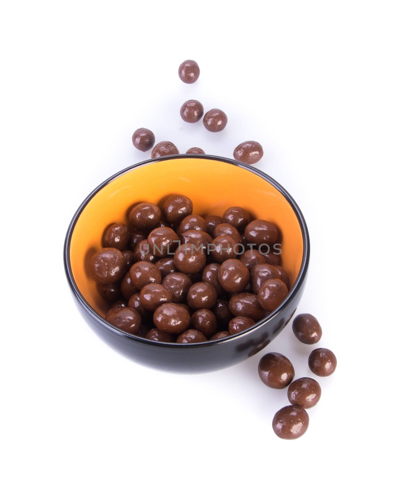 chocolate balls. chocolate balls in bowl on a background.