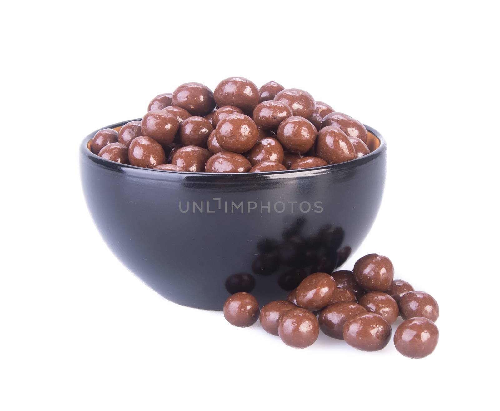 chocolate balls. chocolate balls in bowl on a background by heinteh