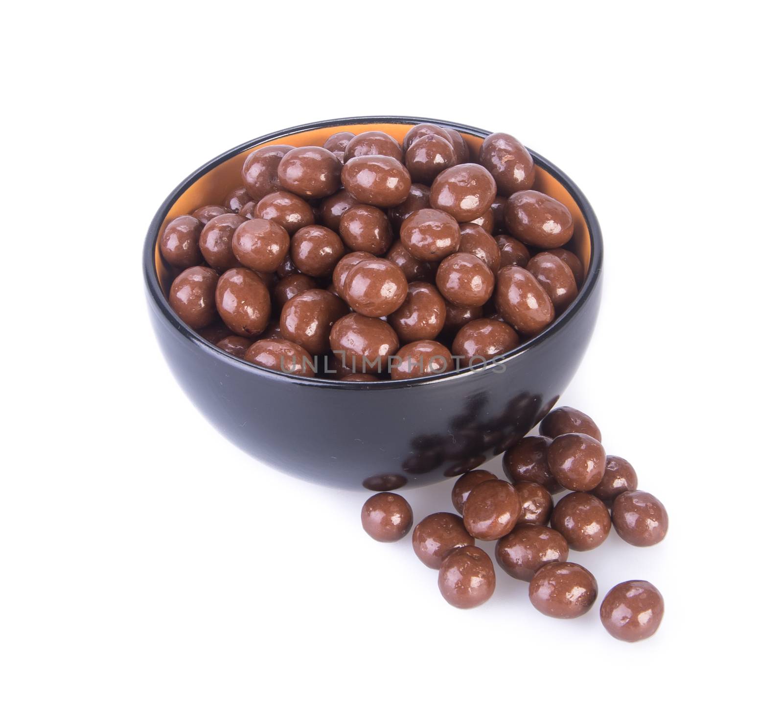 chocolate balls. chocolate balls in bowl on a background.