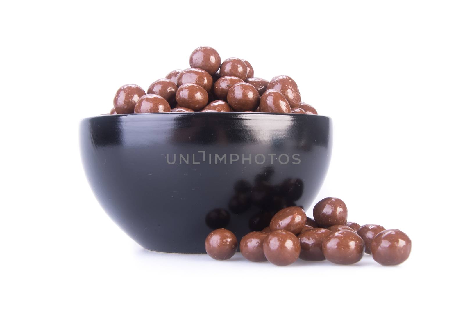 chocolate balls. chocolate balls in bowl on a background.