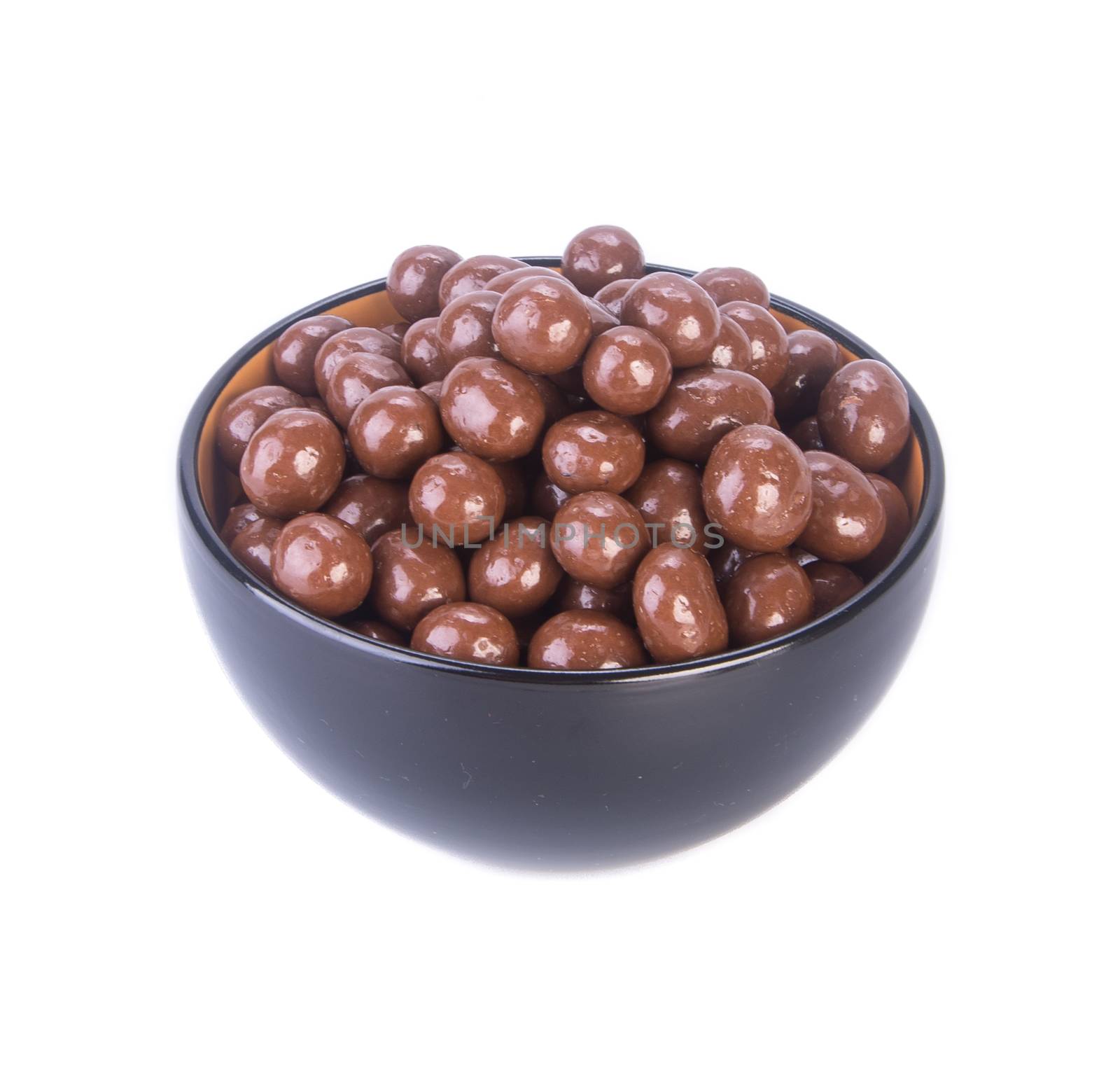 chocolate balls. chocolate balls in bowl on a background by heinteh