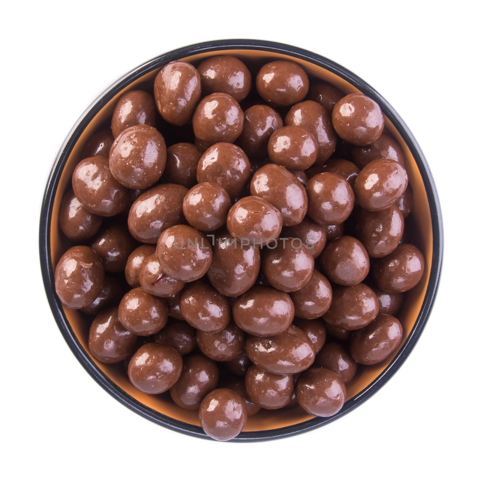 chocolate balls. chocolate balls in bowl on a background by heinteh