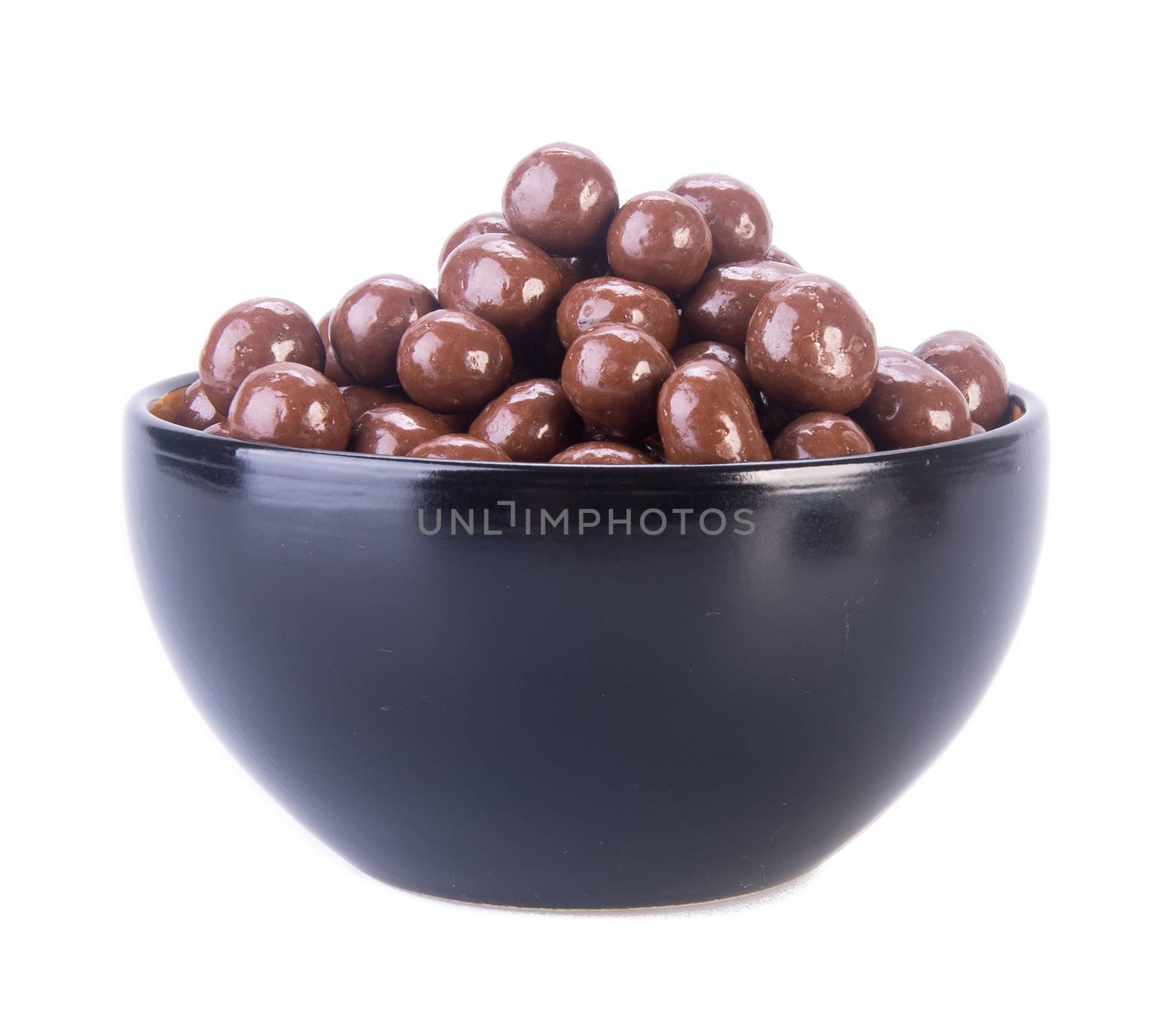 chocolate balls. chocolate balls in bowl on a background by heinteh