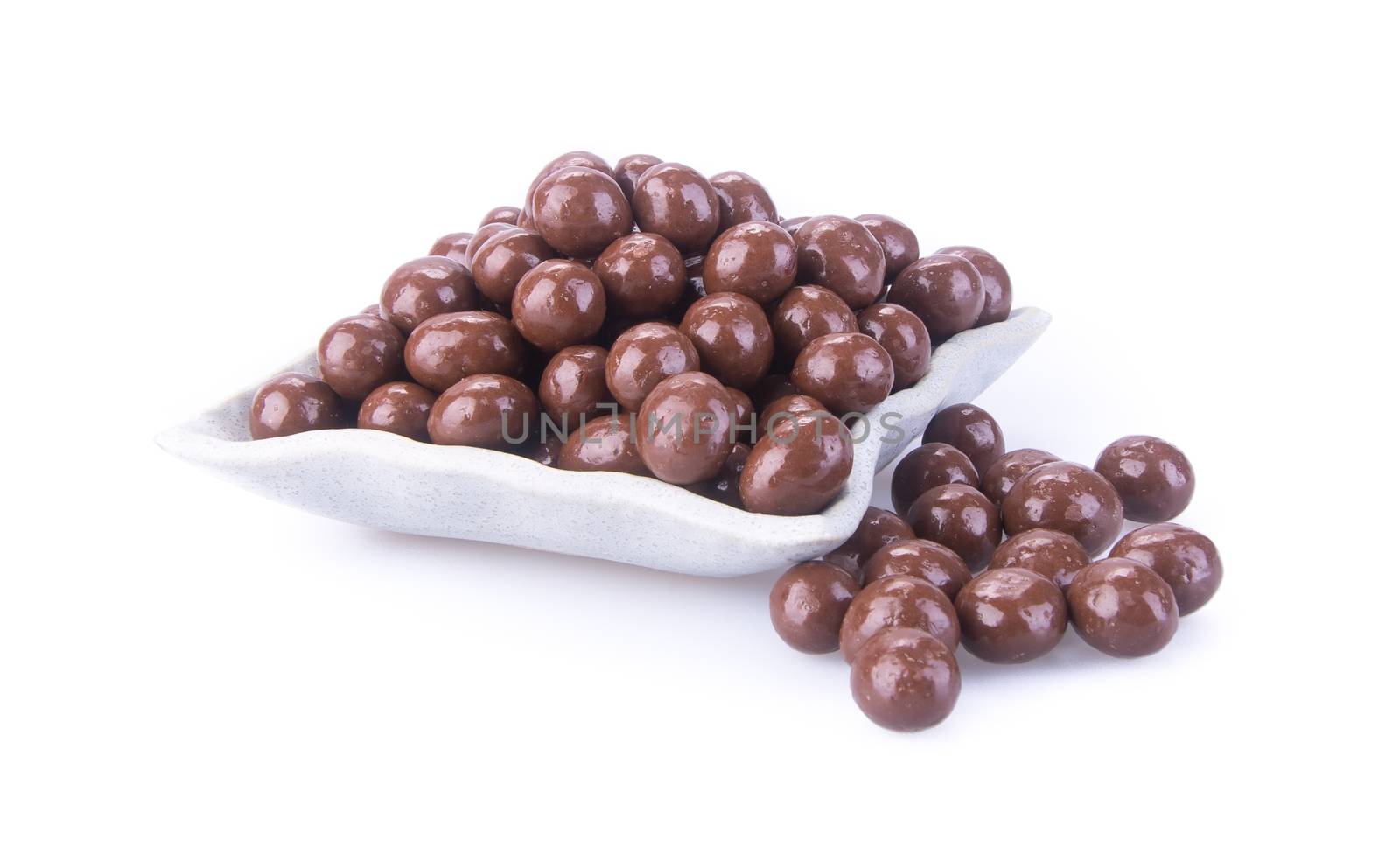 chocolate balls. chocolate balls in bowl on a background by heinteh