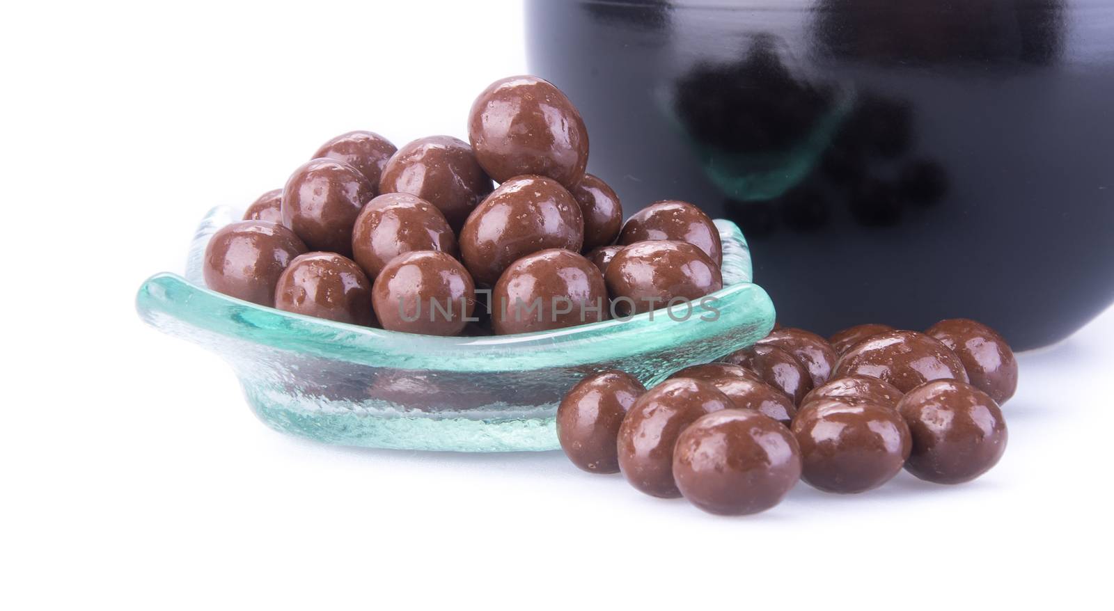 chocolate balls. chocolate balls in bowl on a background by heinteh