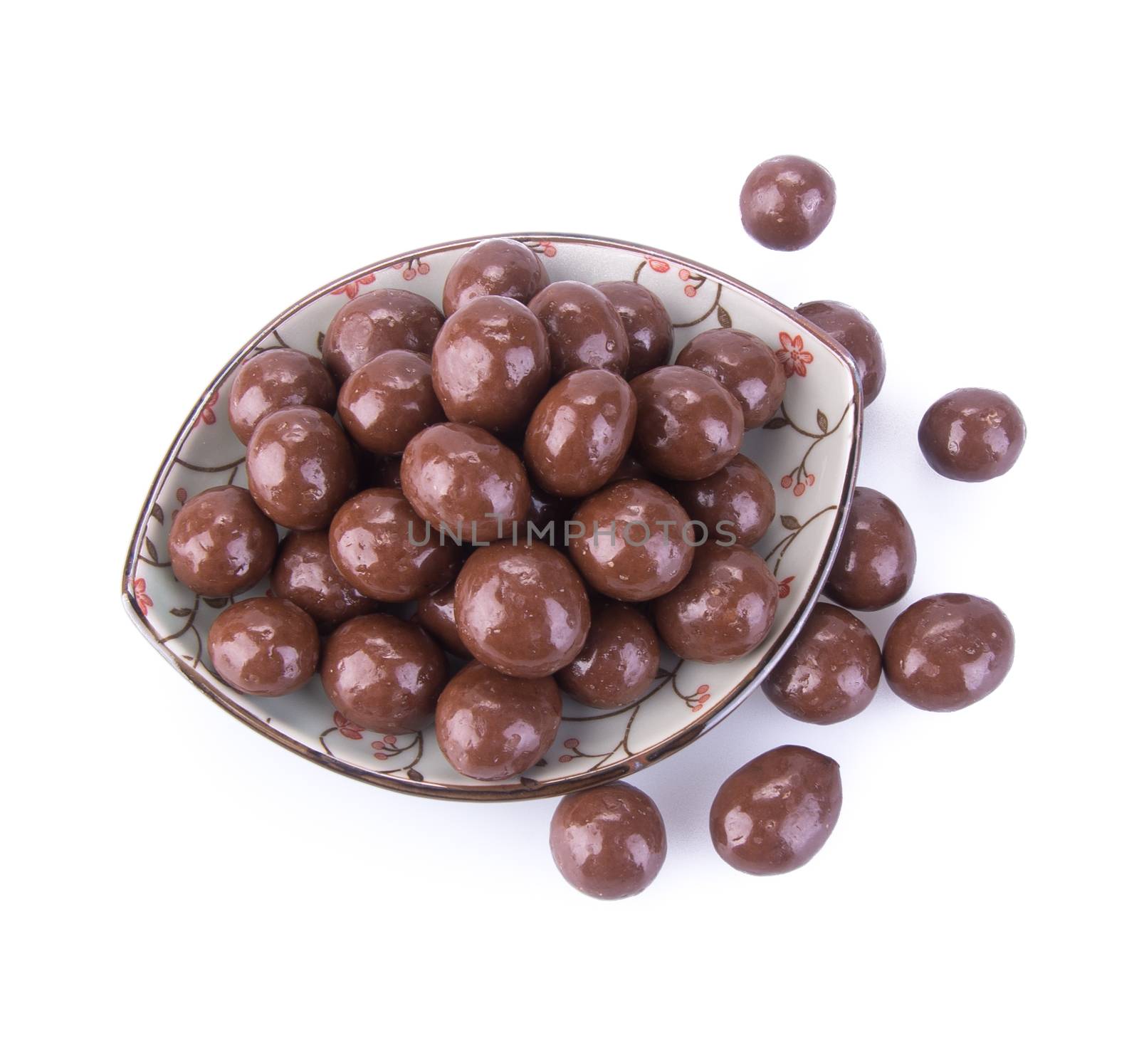 chocolate balls. chocolate balls in bowl on a background.