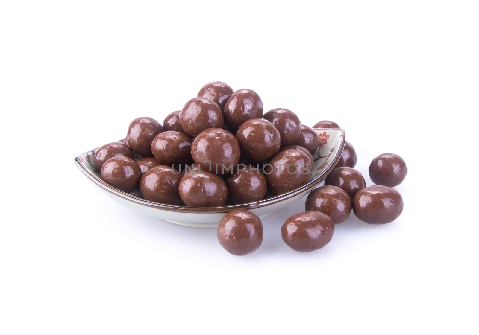 chocolate balls. chocolate balls in bowl on a background.