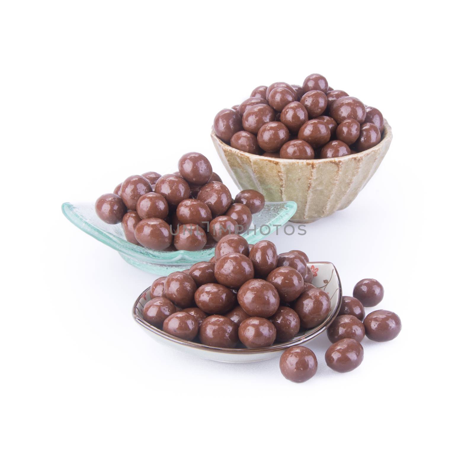 chocolate balls. chocolate balls in bowl on a background.