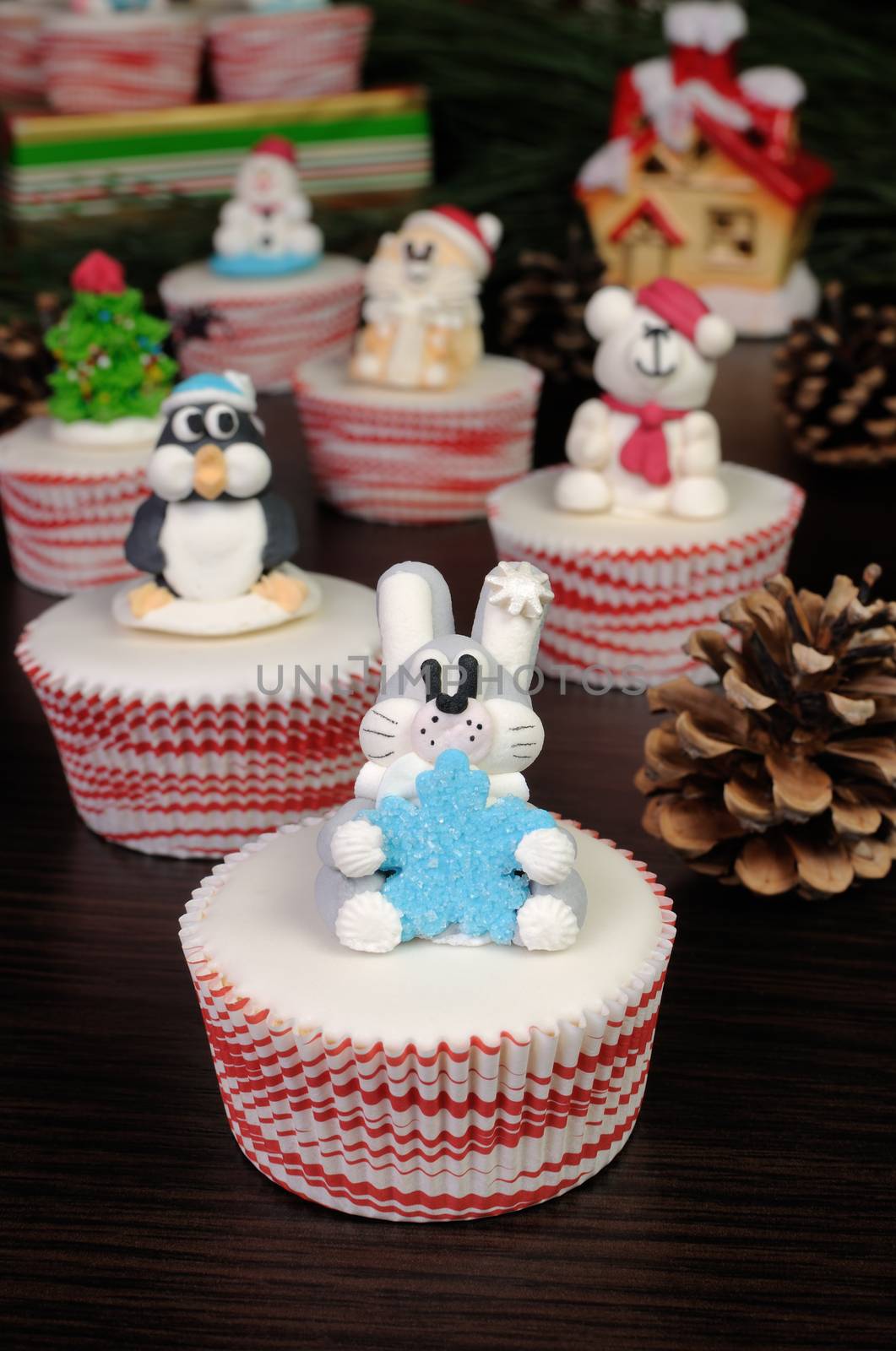 Sugar Christmas figurine rabbit with snowflakes on muffin
