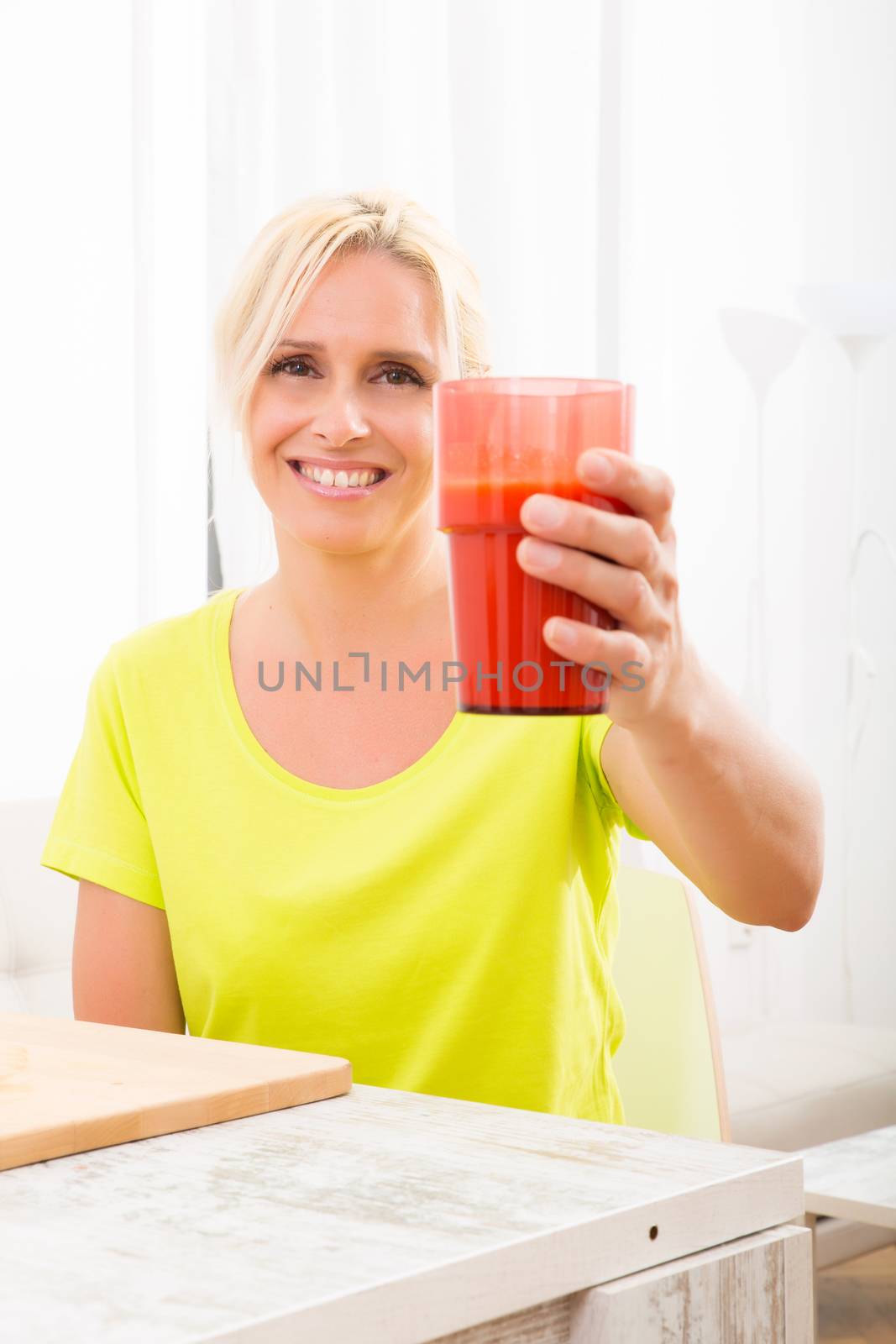 Mature woman enjoying a smoothie			 by Spectral