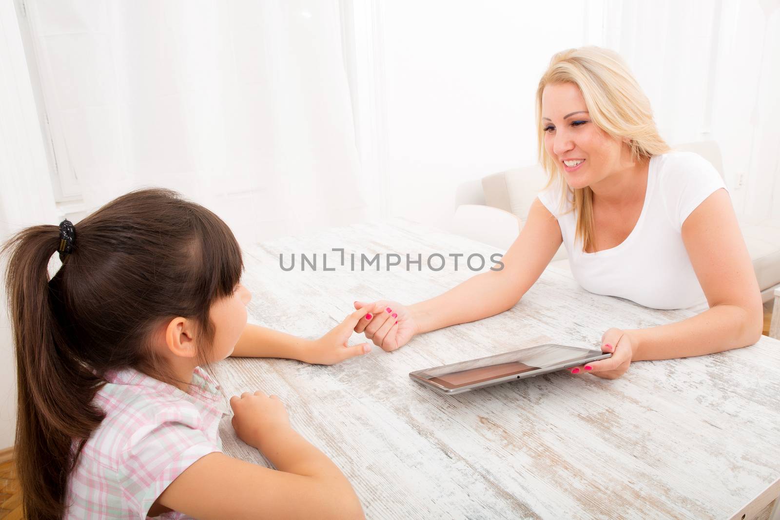 Mother and Daughter with a Tablet PC by Spectral