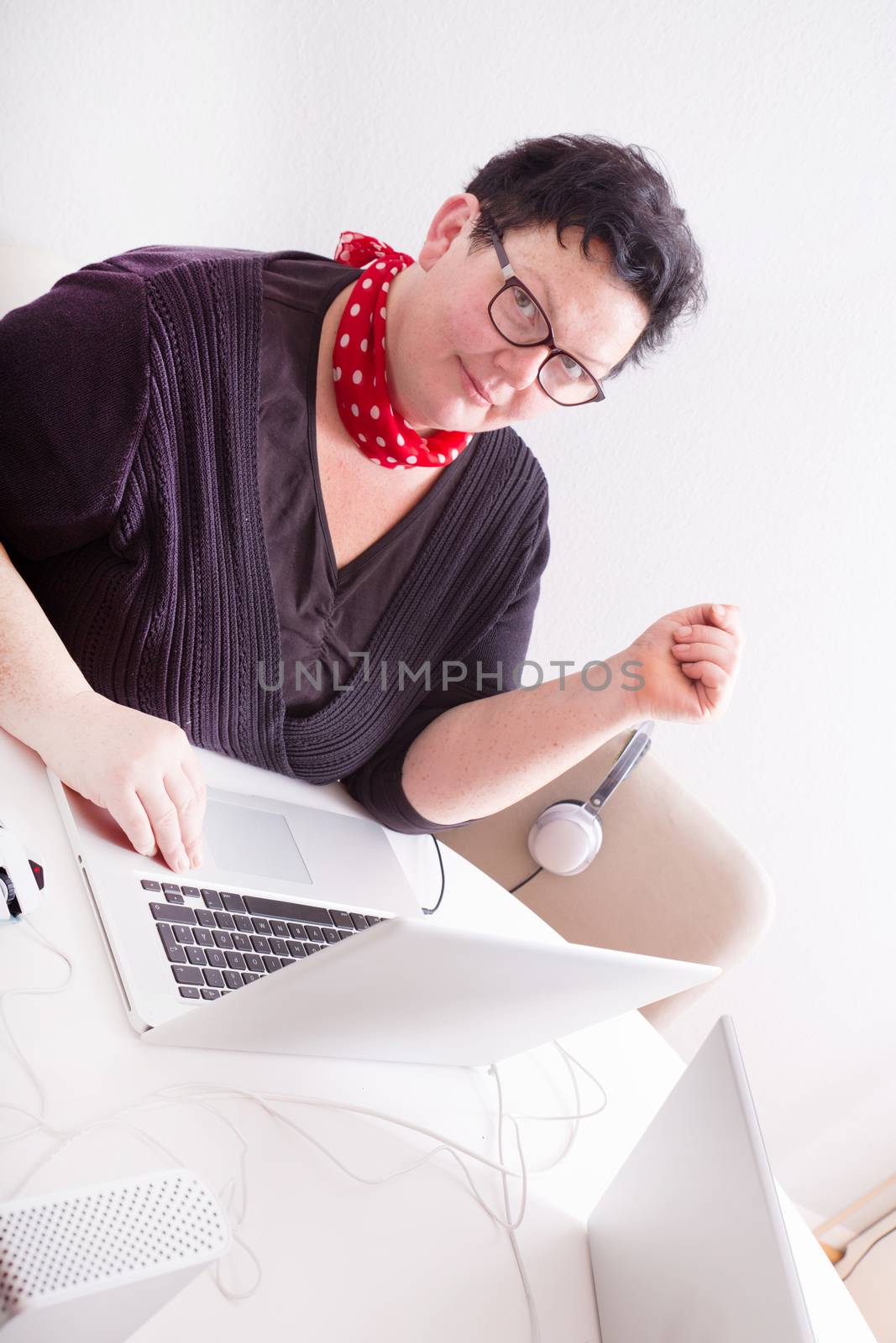 Portrait of an overweight mature woman in the office.
