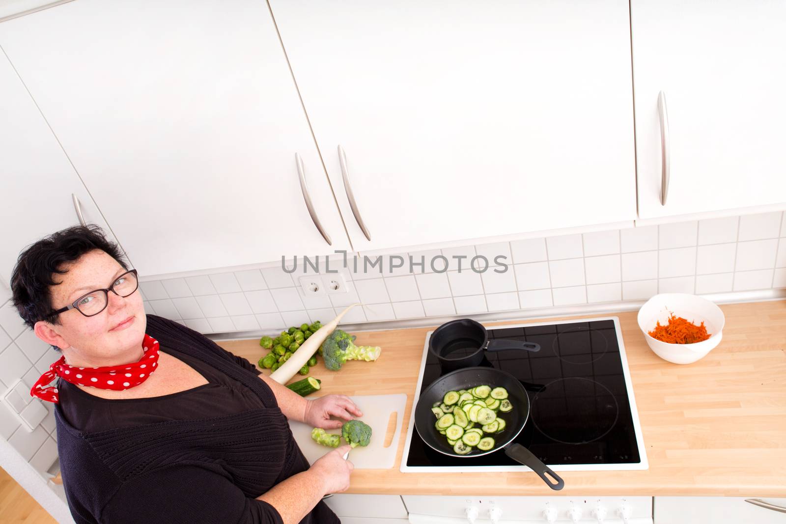 Woman cutting vegetables  by Spectral