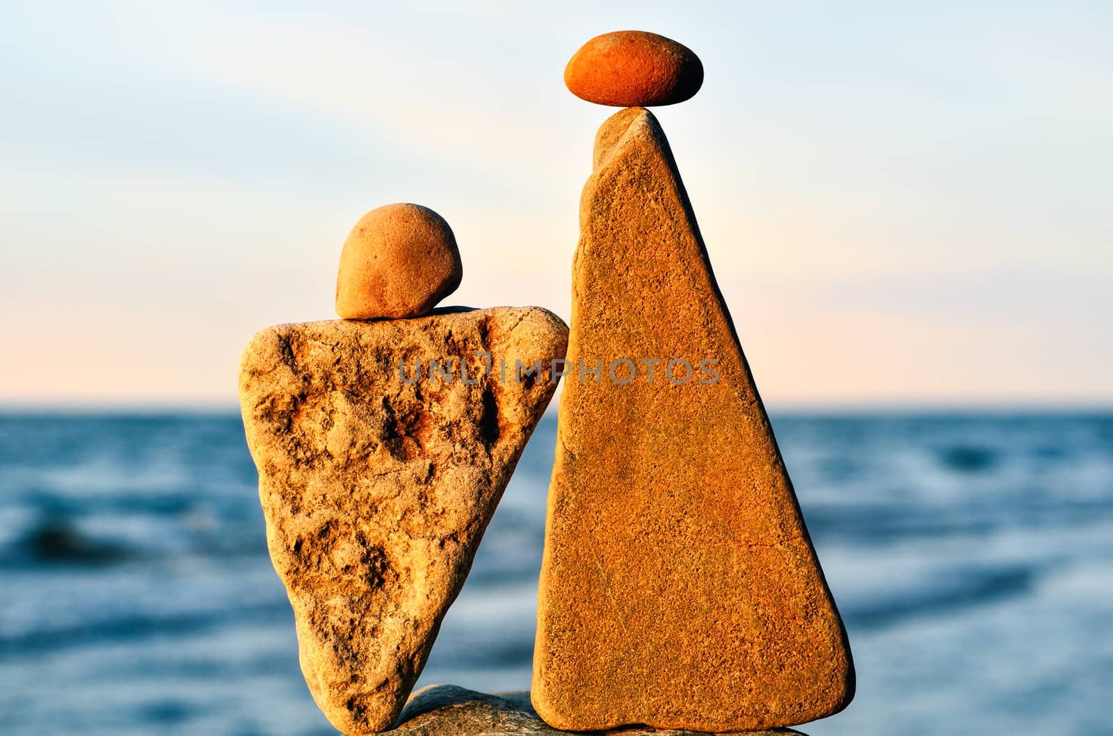 Balancing of two triangle stones on the seacoast