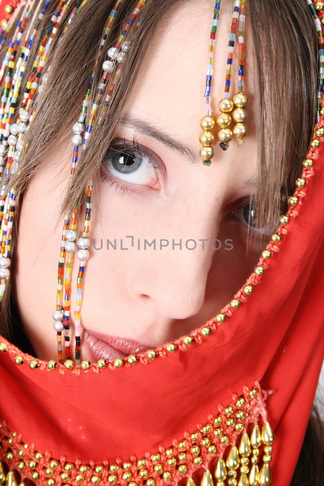 Beautiful young teenager posing in a belly dance costume 