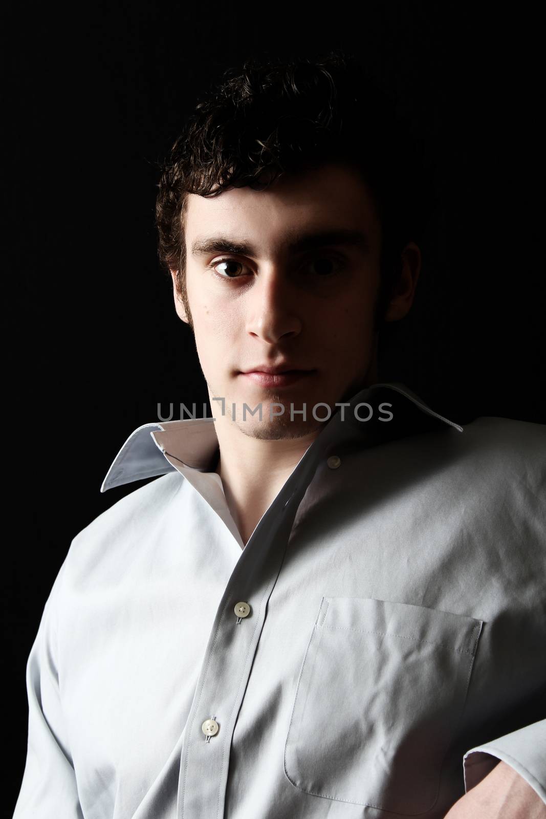 Attractive brunette male in suit with white shirt 