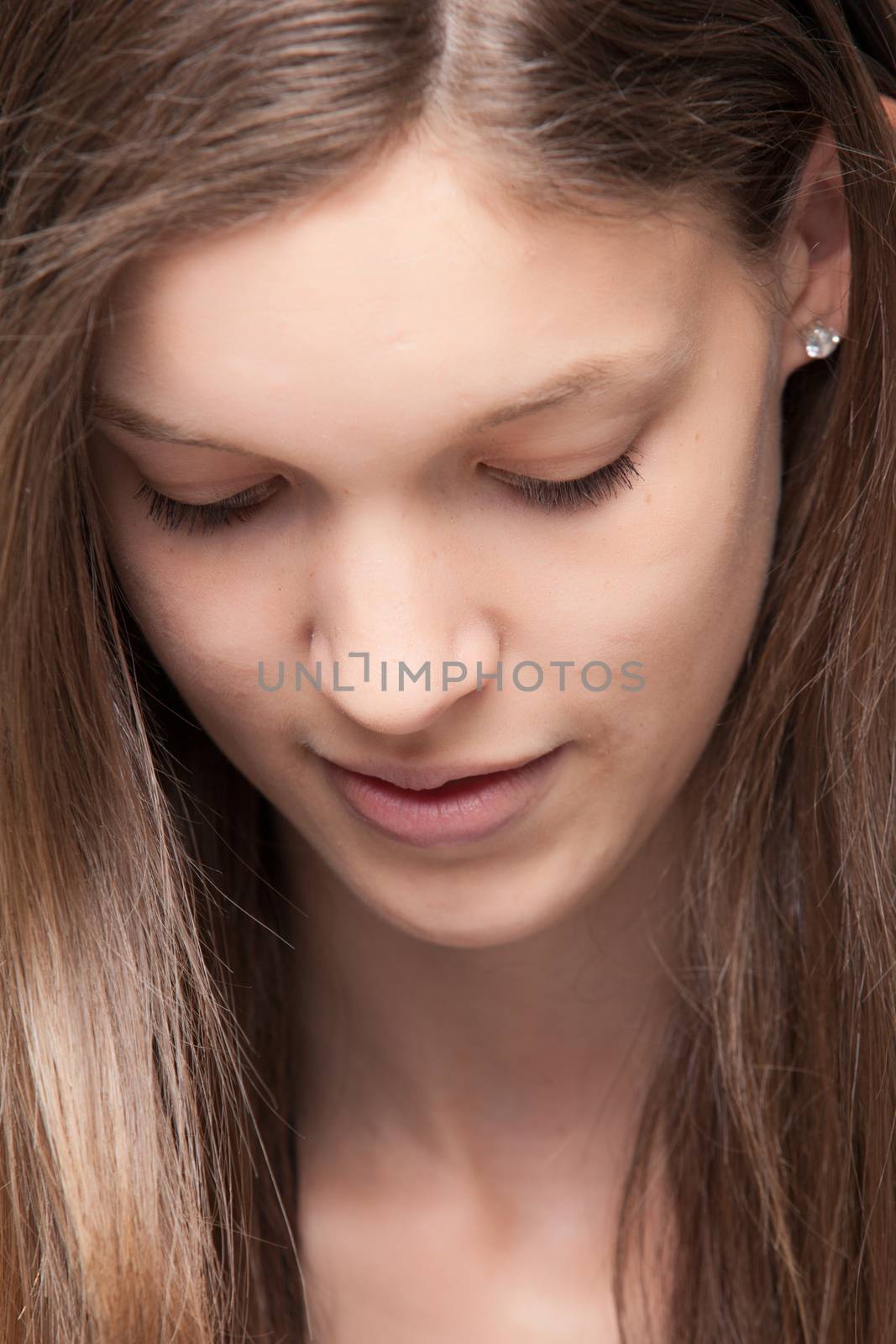 Young girl is looking down by DNFStyle