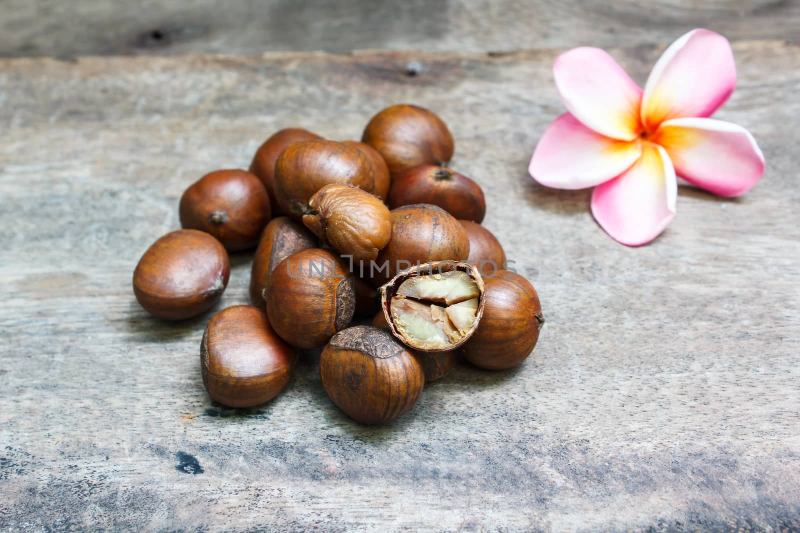 sweet chestnut on wood background, food.