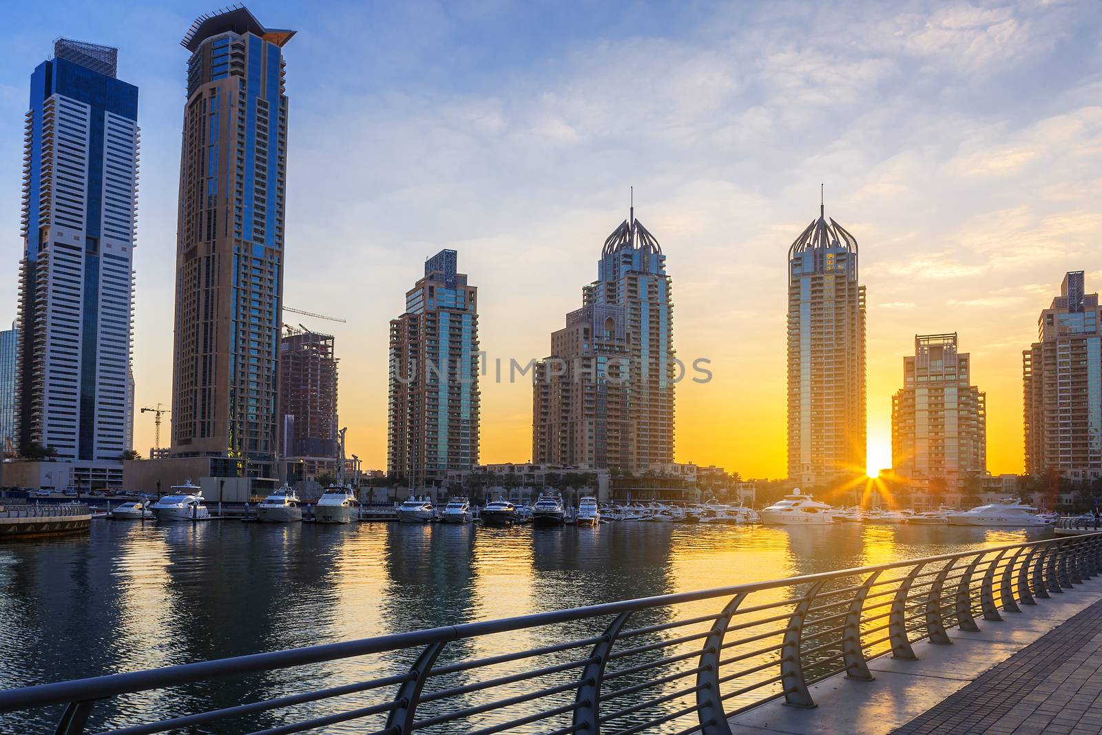 View of Skyscrapers in Dubai Marina at sunrise, UAE.