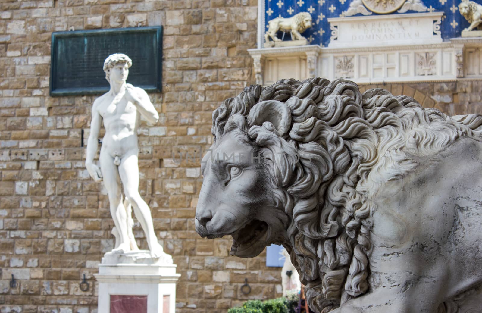 Lion statue stands at the entrance of the Loggia dei Lanzi in Piazza della Signoria in Florence