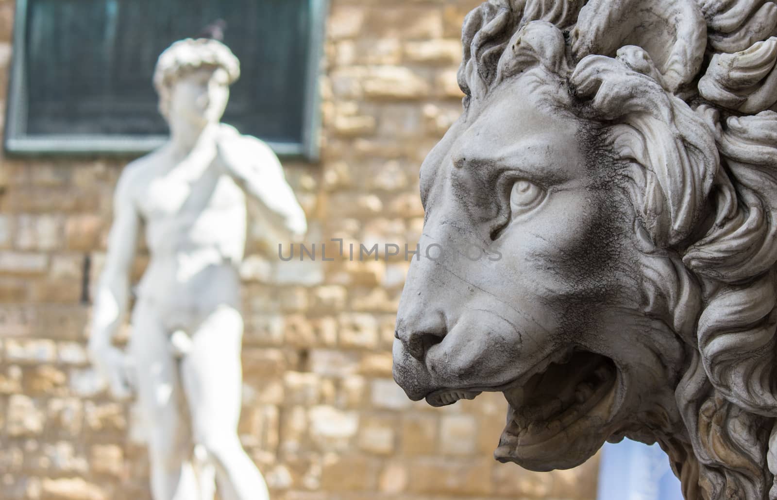 Lion statue stands at the entrance of the Loggia dei Lanzi in Piazza della Signoria in Florence