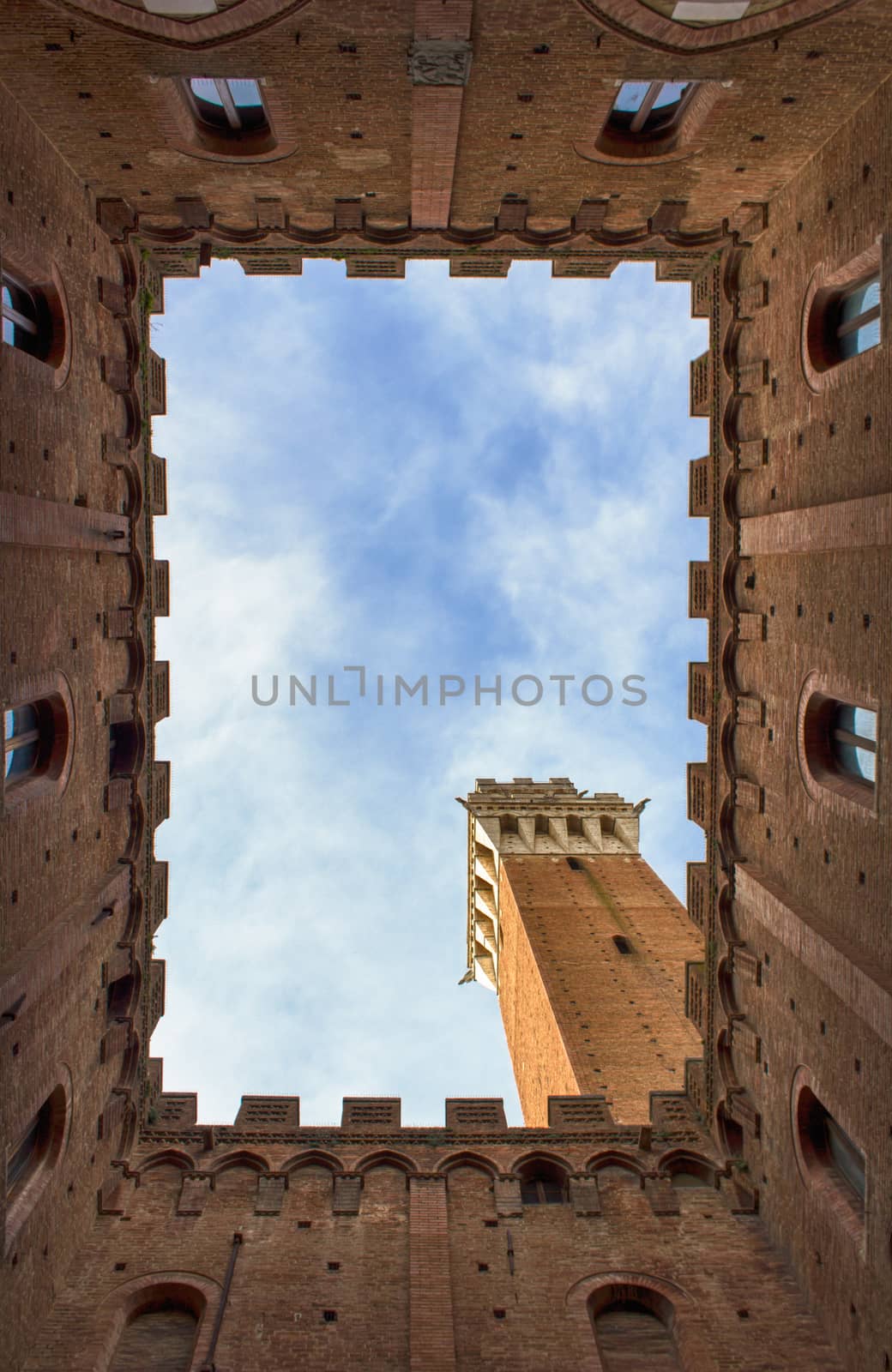  Siena in Italy inside the courtyard of the town hall co the view of the tower