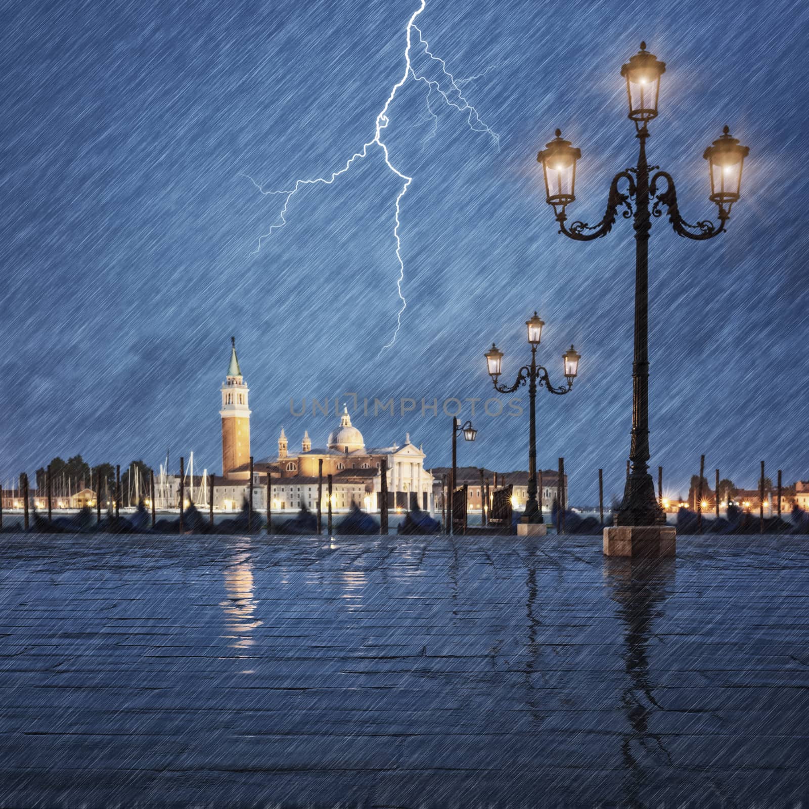 Thunderstorm with lightning in the sky on the Grand Canal, Italy 