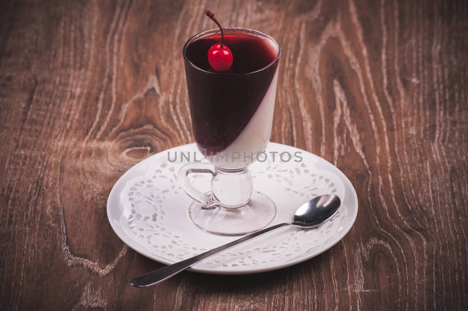 jelly dessert with whipped cream and cherry 