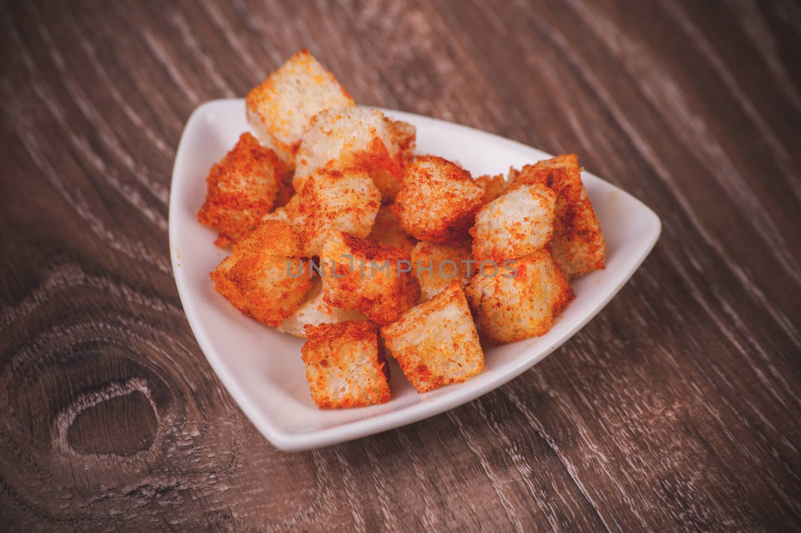 golden fried paprica croutons served in bowl