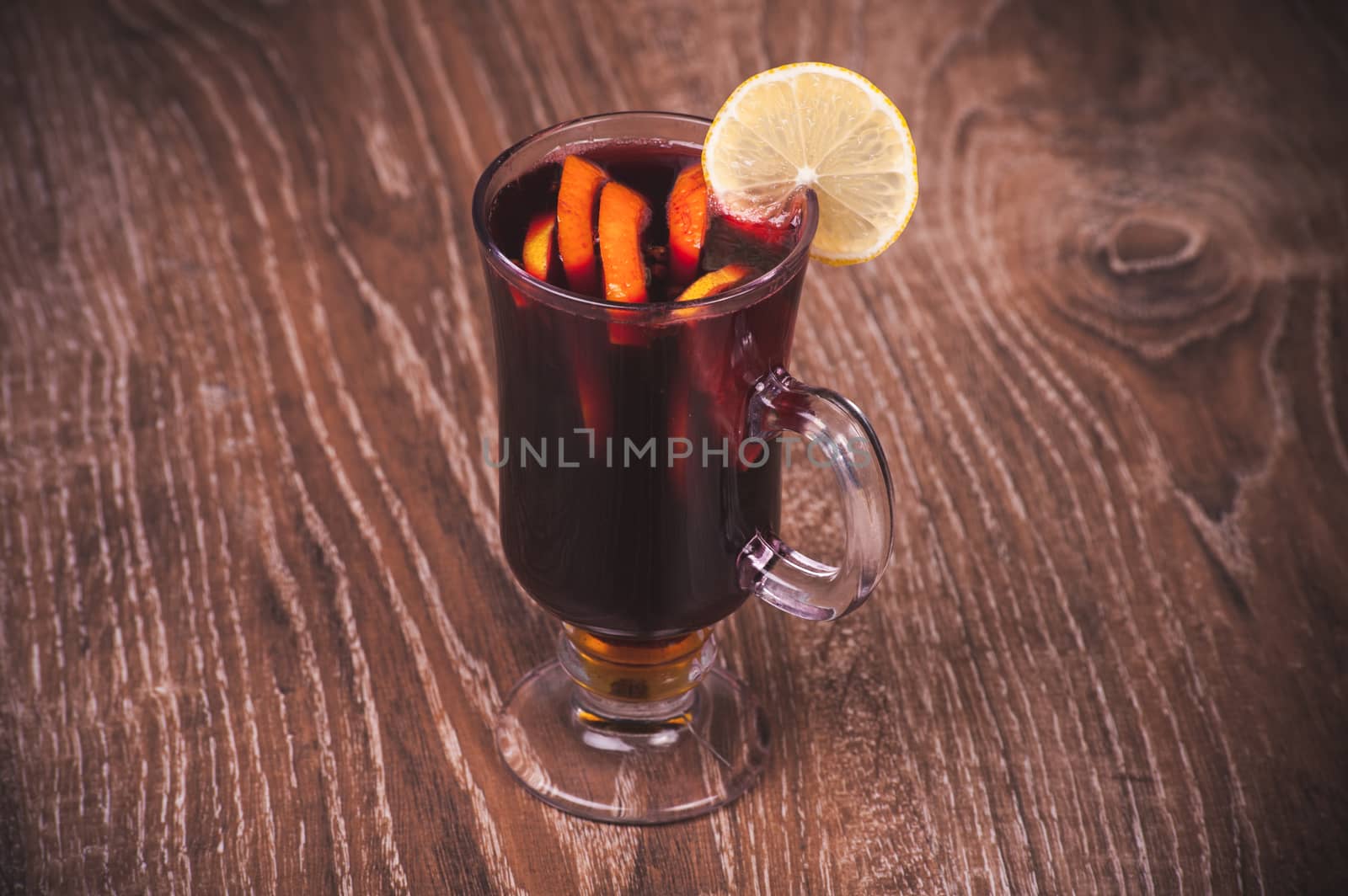 red mulled wine in glass with orange