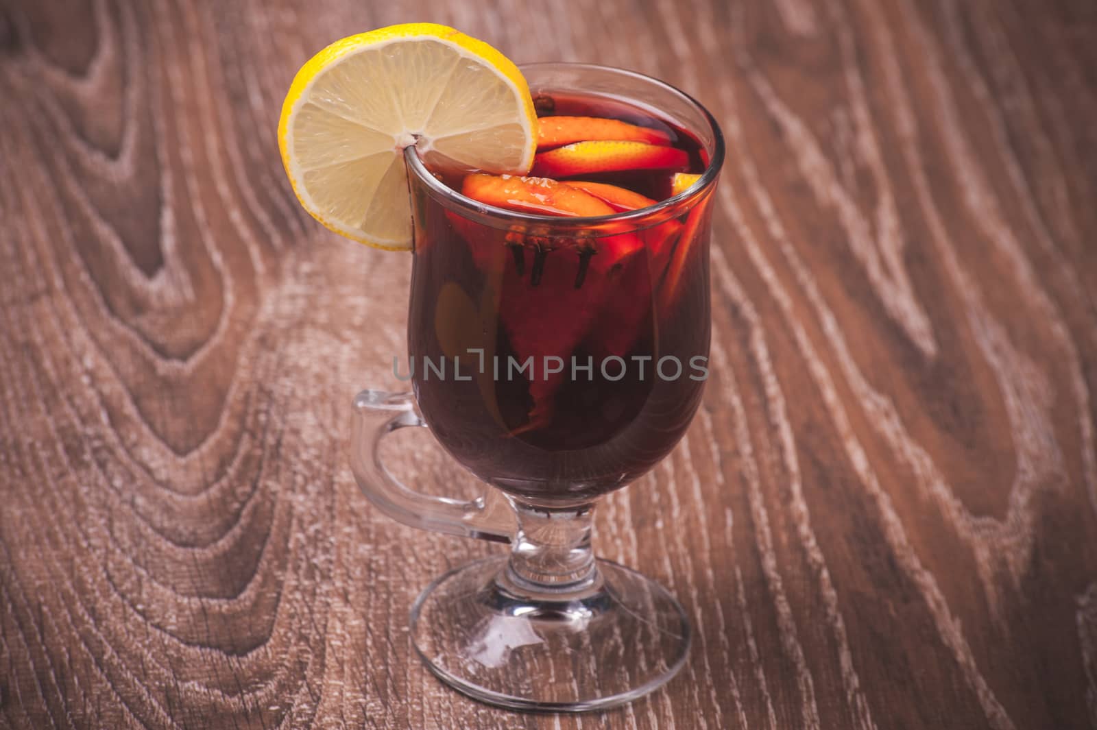 red mulled wine in glass with orange
