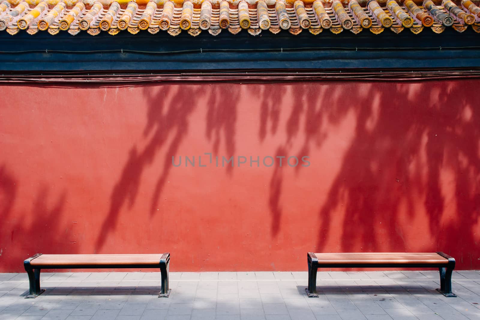 Bench in The Forbidden City with red wall