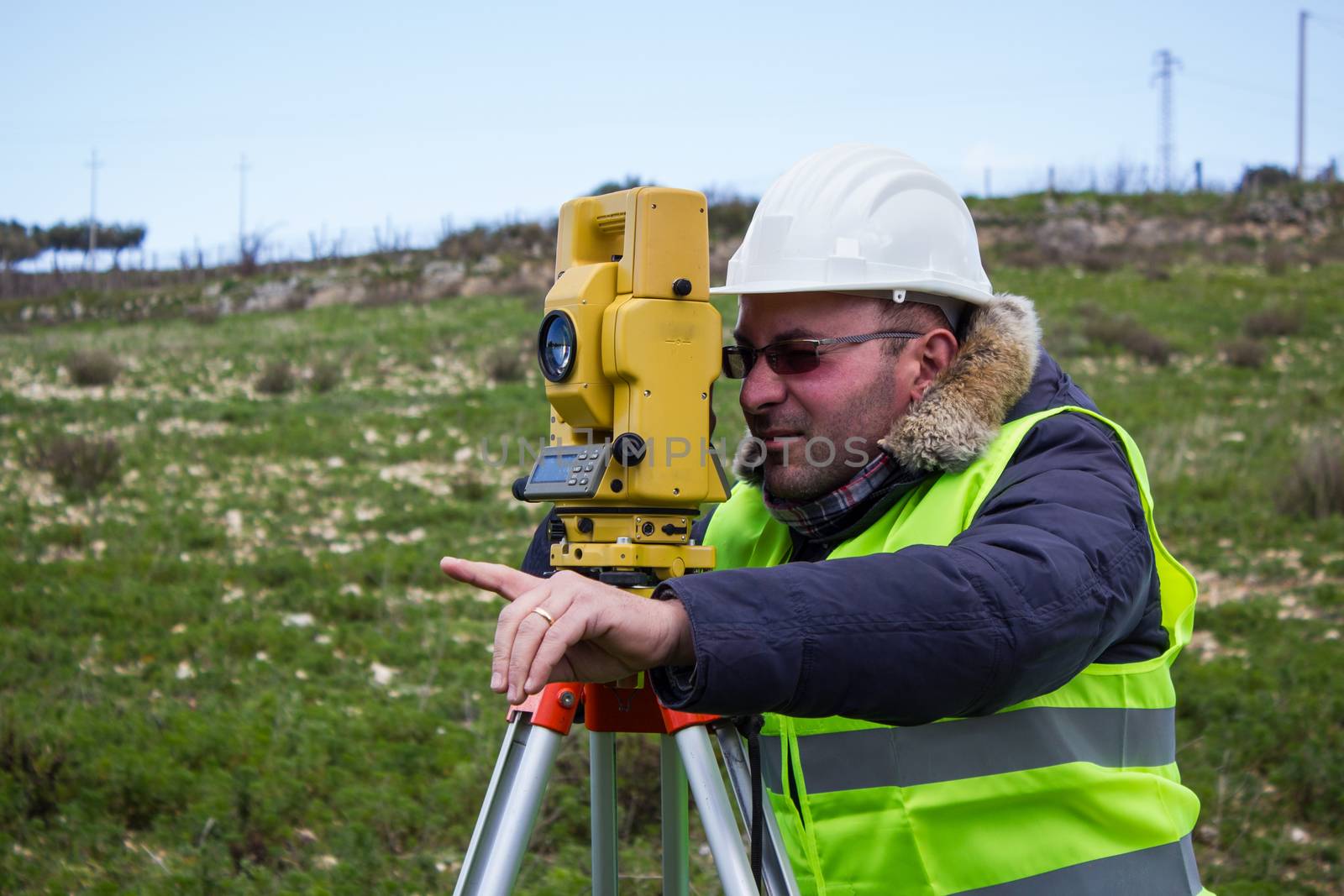 Engineer with a theodolite for measuring topographic