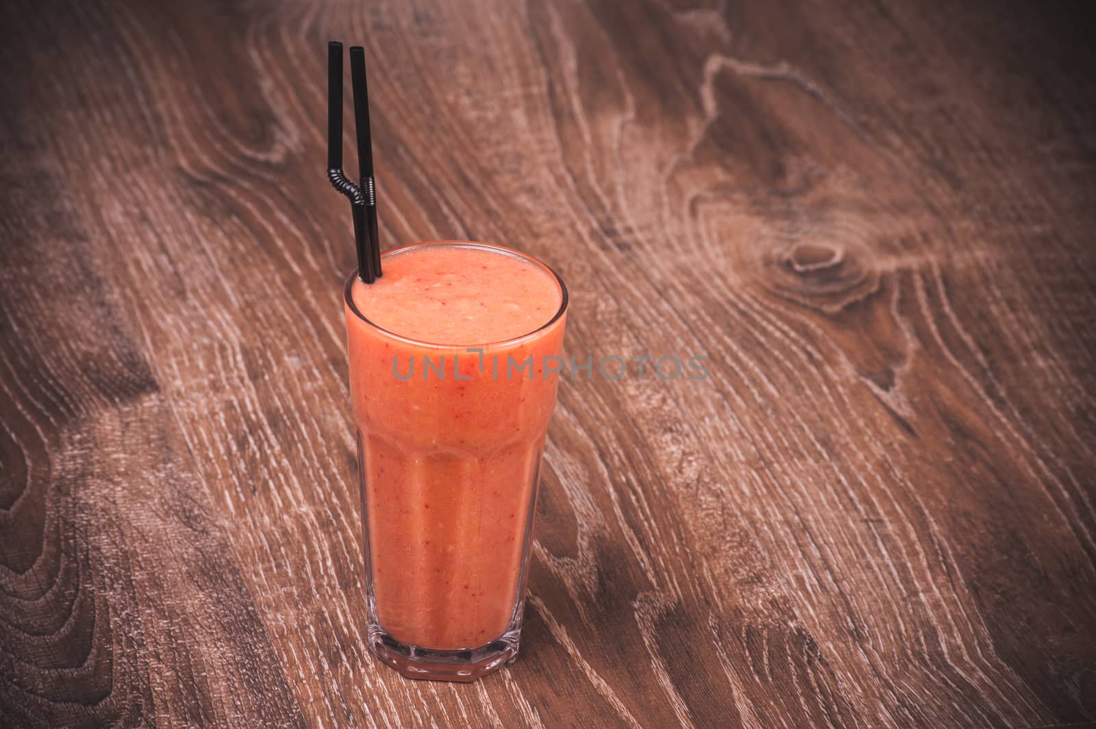 fruit, orange and mango smoothie in glass