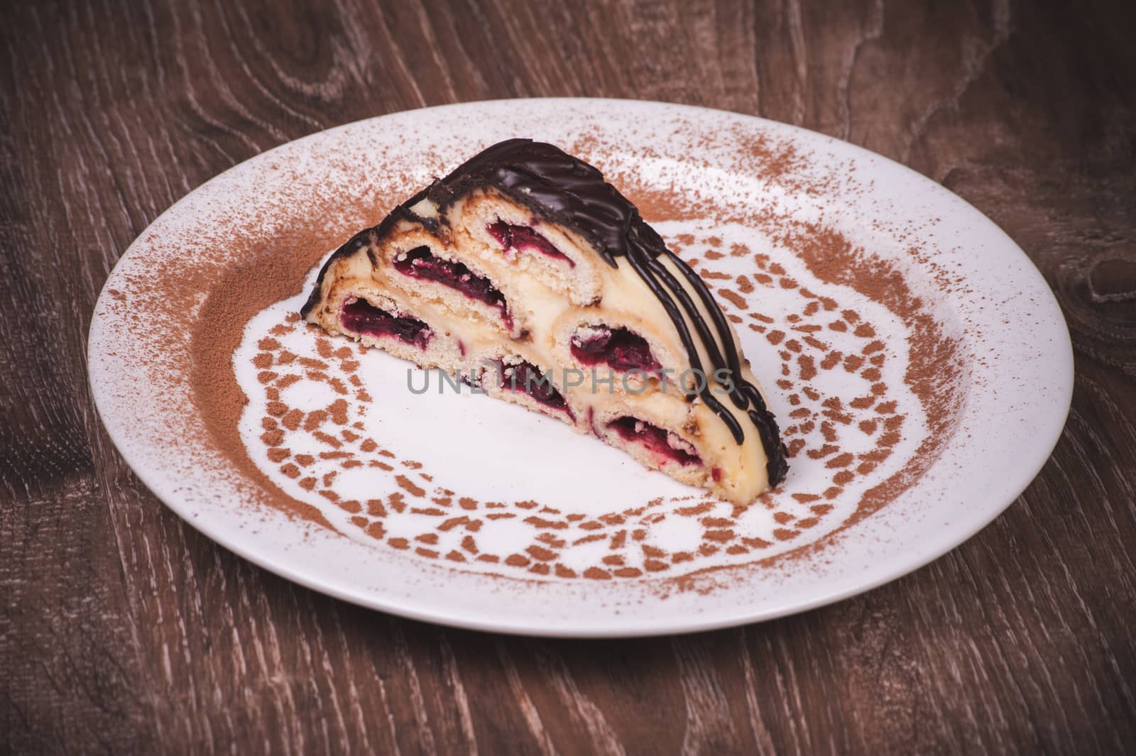 Slice of fruit cake on white plate 