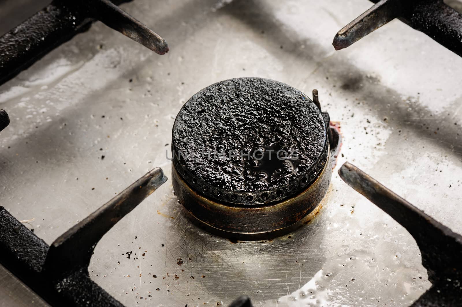 Real industrial kitchen, dirty gas burner closeup