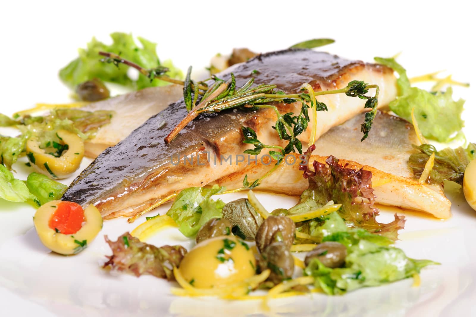 Pompano or dorada fish fillet fried and served with herbs