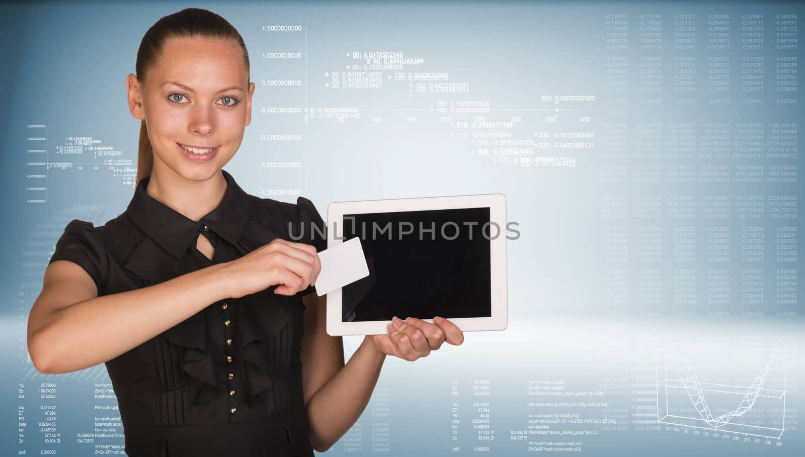 Beautiful businesswoman holding blank tablet PC and blank business card in front of PC screen. Hi-tech graphs and rows of figures as backdrop