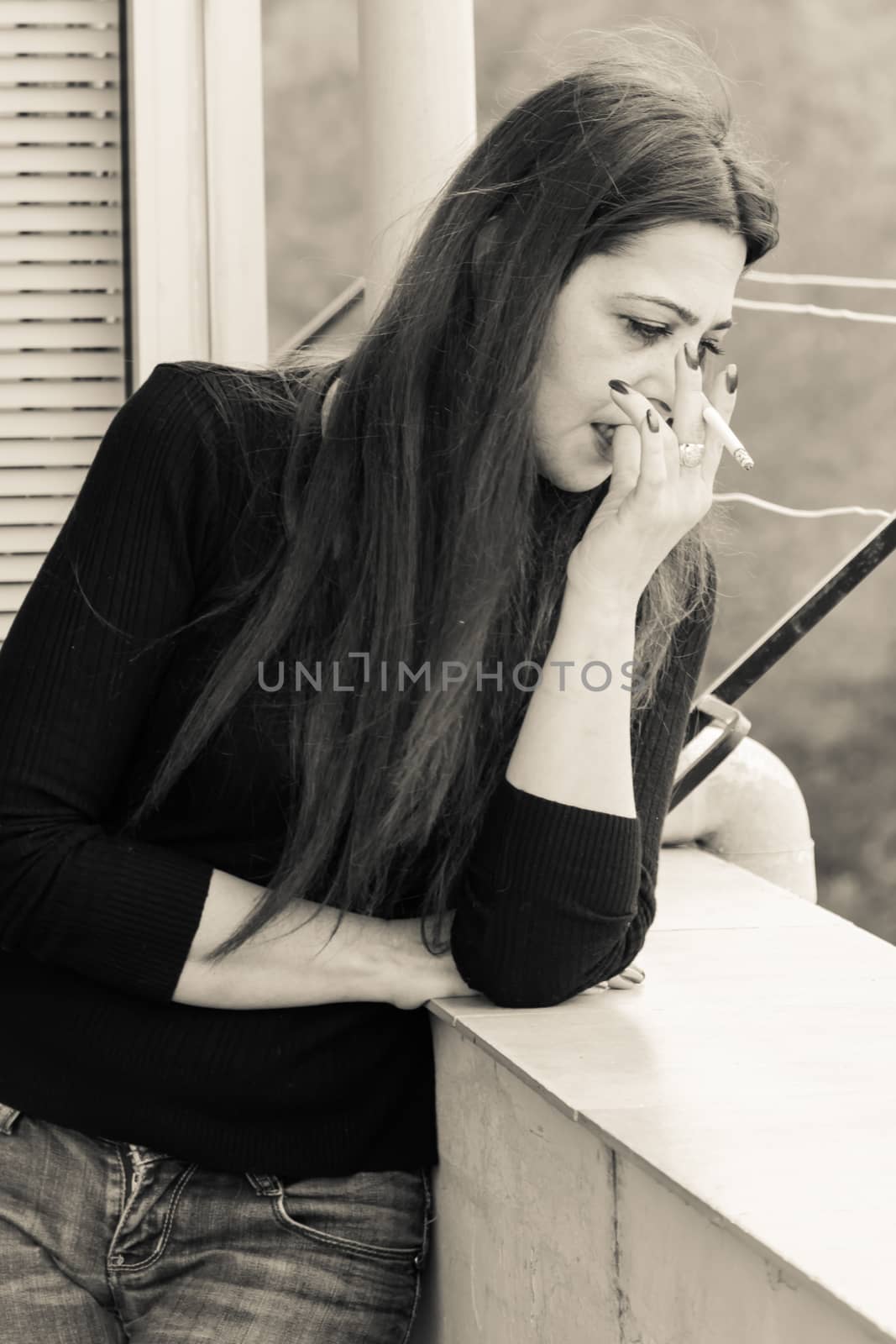 True sicilian Smoking woman in a terrace