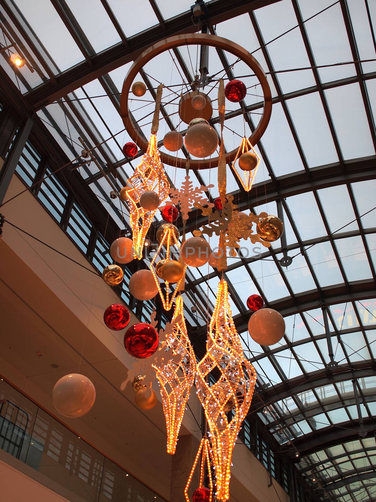 City shopping mall decorated for Christmas with shiny colorful balls and light