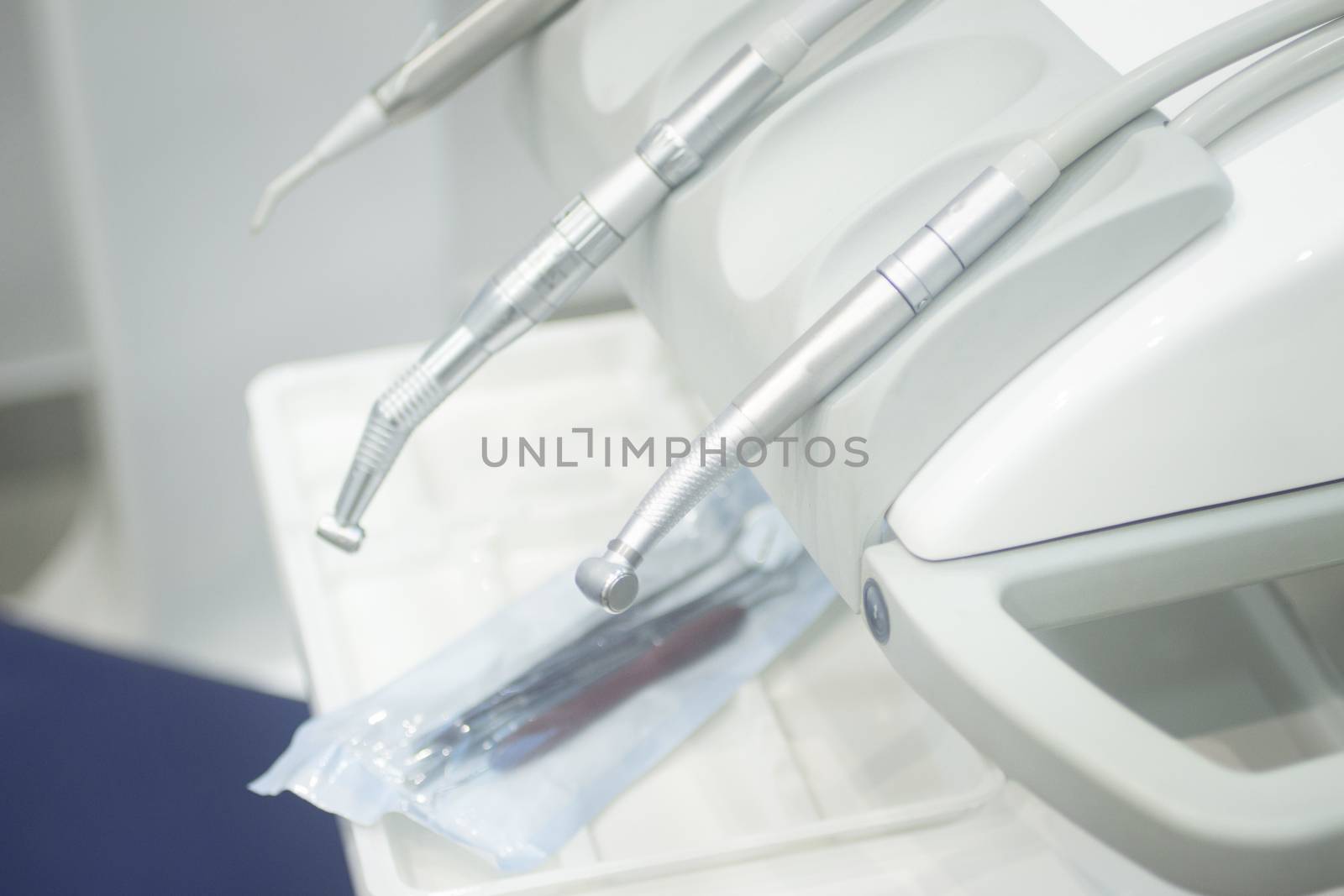 Dental instrumenation dentist drill and cleaning tool in denstists surgery clinic vertical color photo. 