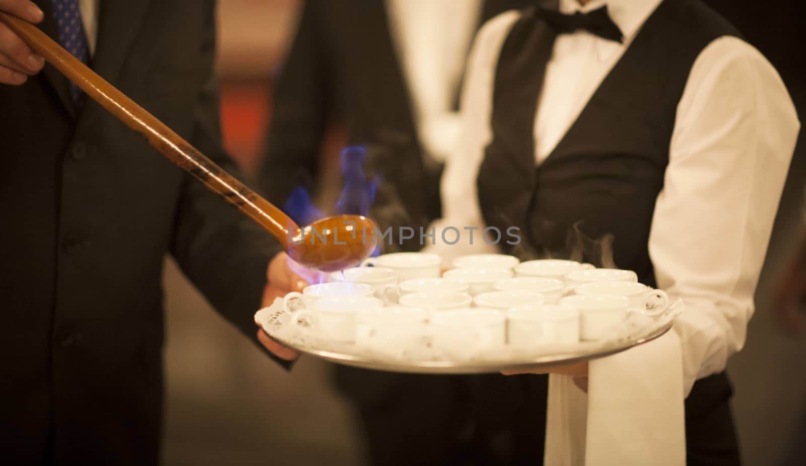 Queimada burning hot Galician alcohol drink waiter in wedding in Santander in Galicia. 