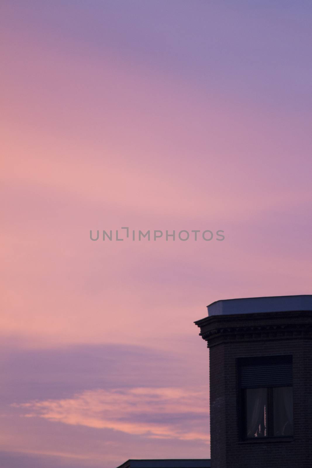 City building roof silhouette and dusk sunset sky by edwardolive
