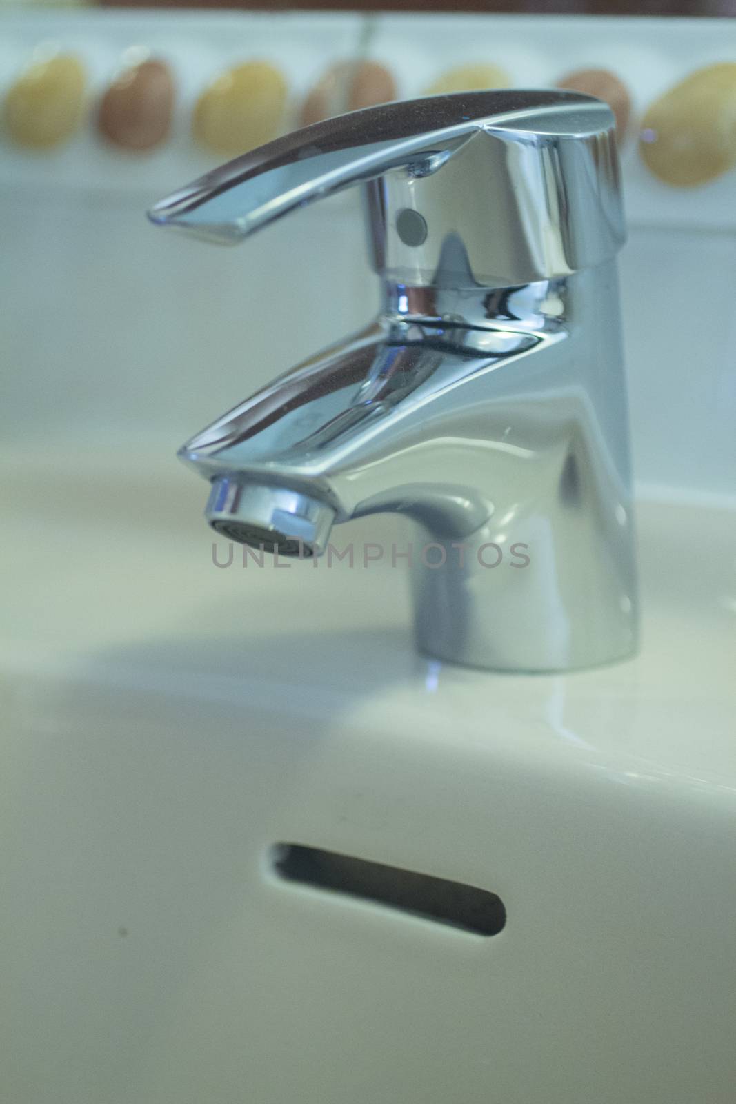 Domestic bathroom wash basin tap close-up by edwardolive