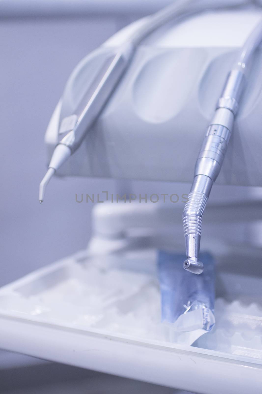 Dental instrumenation dentist drill and cleaning tool in denstists surgery clinic vertical color photo. 