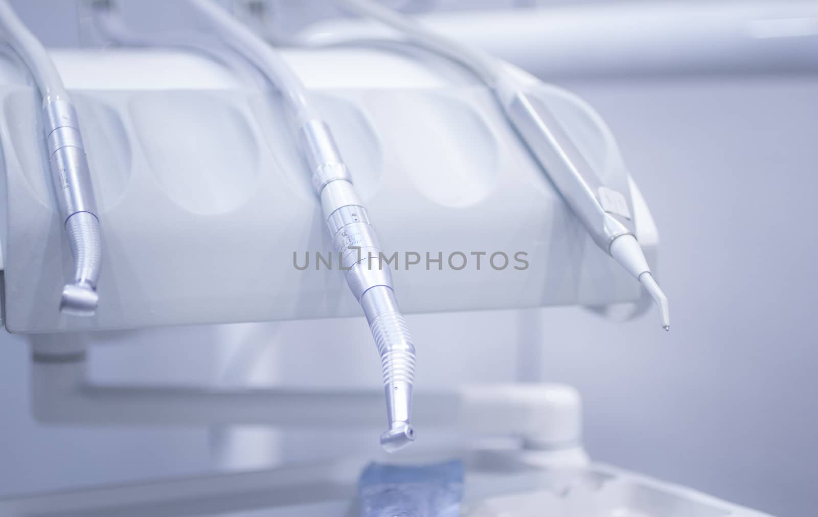 Dental instrumenation dentist drill and cleaning tool in denstists surgery clinic vertical color photo. 