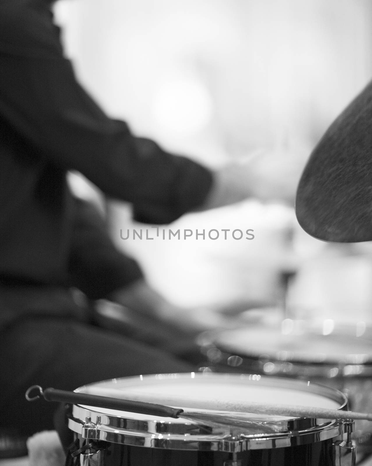 Drummer playing drumset in wedding party reception by edwardolive