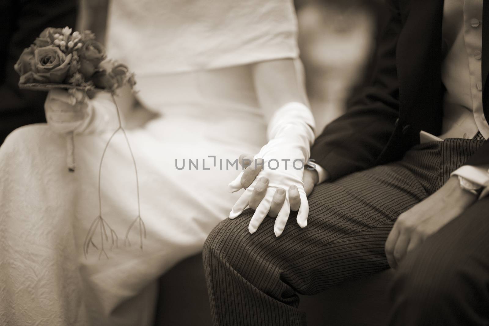 Hands of bride and bridegroom in wedding marriage ceremony by edwardolive