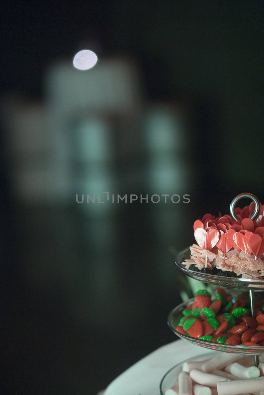 Candy bar heart and strawberry sweets trolley in wedding by edwardolive